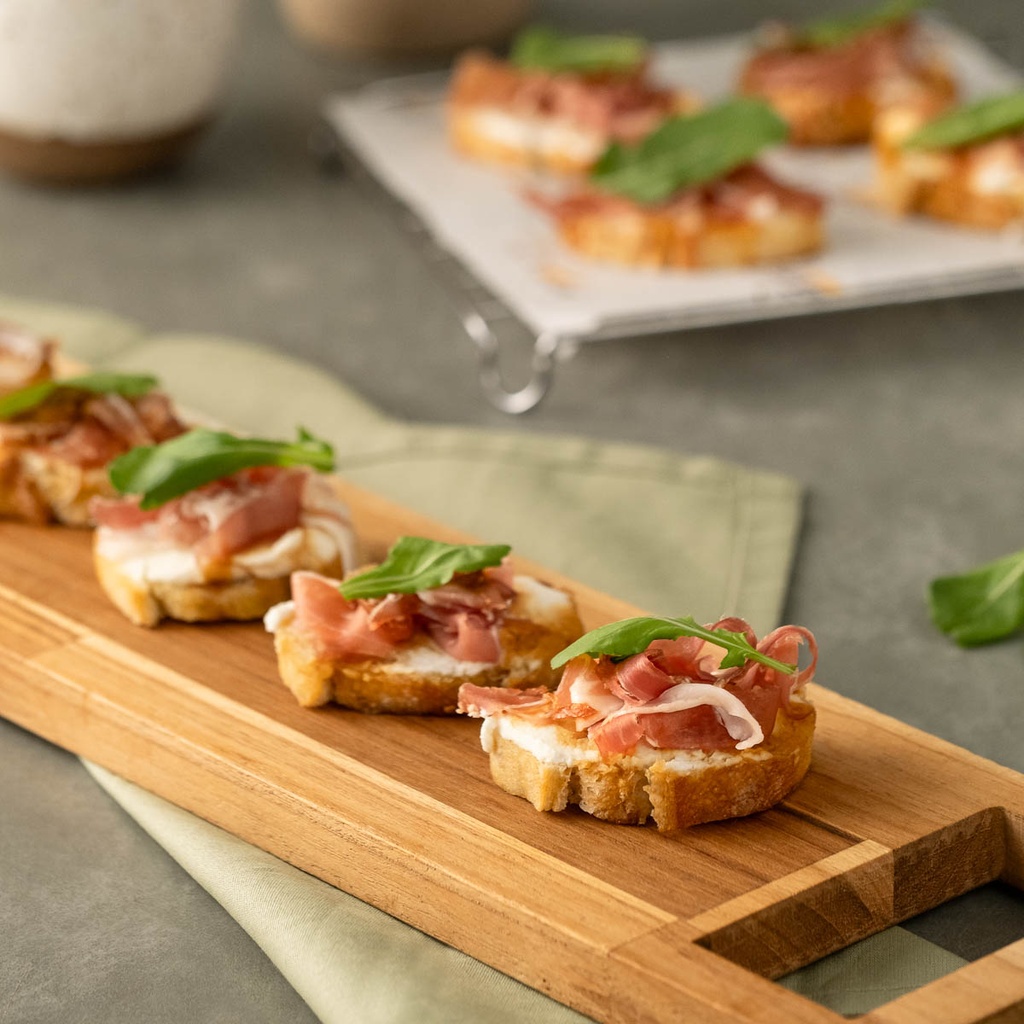 Canapé de creme siciliano, parma, mel de figo e rúcula